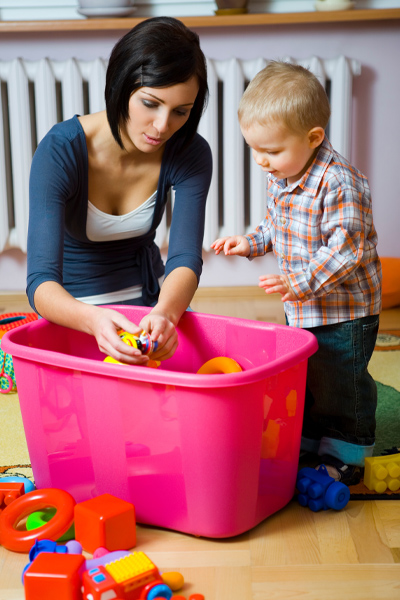 Woman and baby playing with box of toys